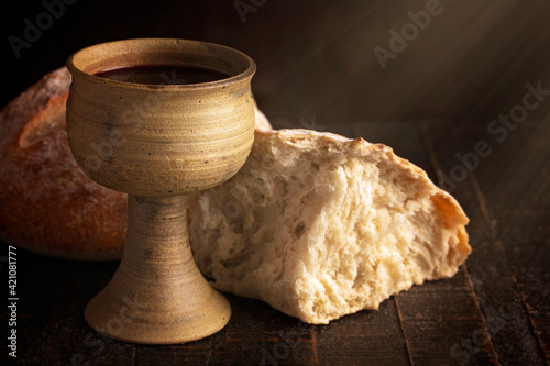 Sacrament of Holy Communion  on a Dark Wooden Table photo