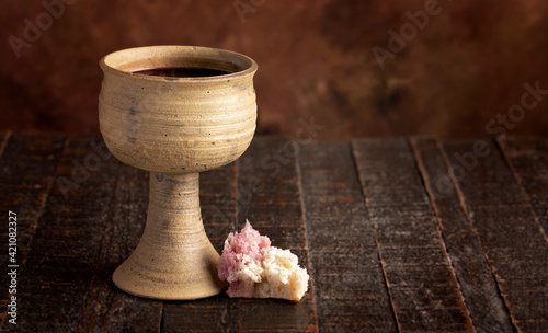 Sacrament of Holy Communion on a Dark Wooden Table