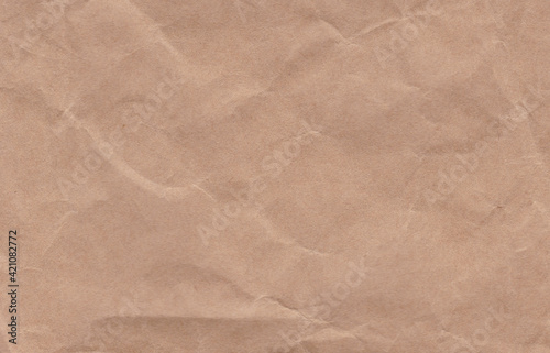 Crumpled cream paper background texture. Paper craft