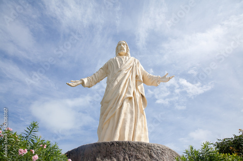 statue of christ the saviour at pilgrimage island , hundred islands national park photo