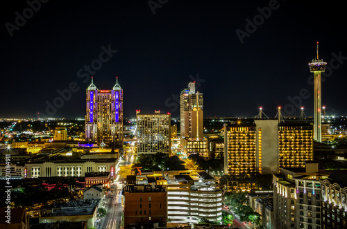 San Antonio city skyline panorama at night. The skyline in this photo includes Marriott Rivercenter, The Torch of Friendship, Marriott Riverwalk