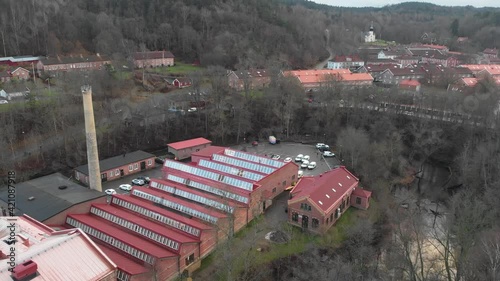 Aerial view of Jonsered's factories industrial community belted by trees, Sweden photo