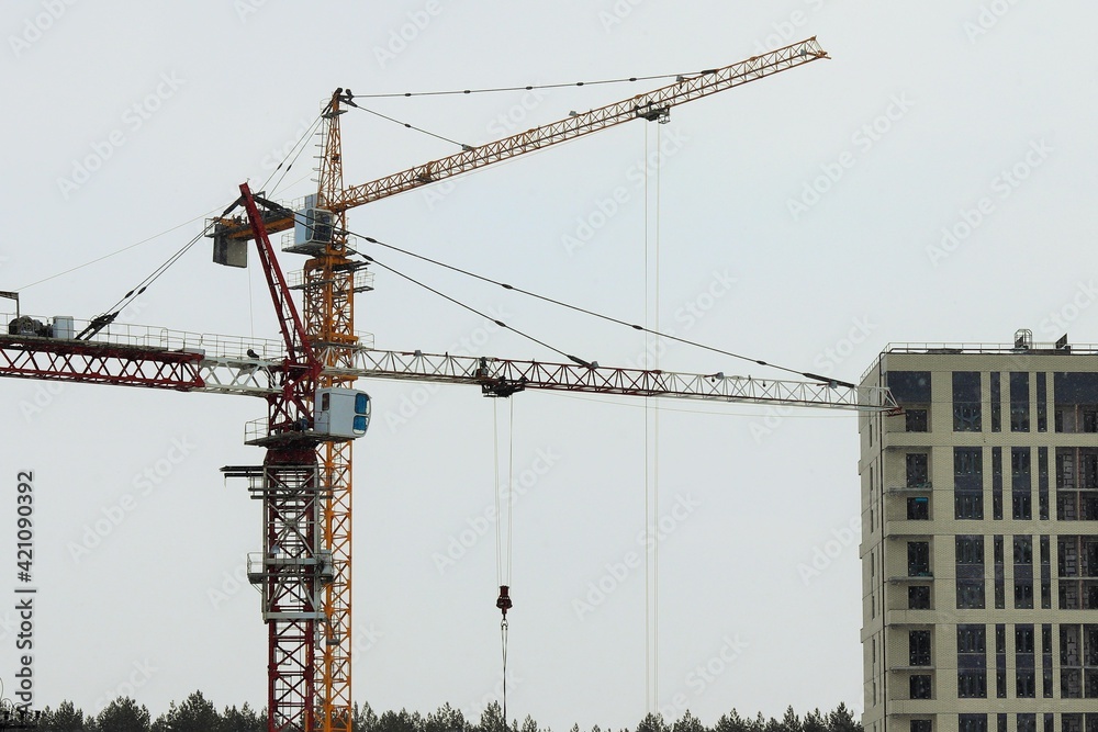 Construction cranes, construction of residential multi-storey buildings 