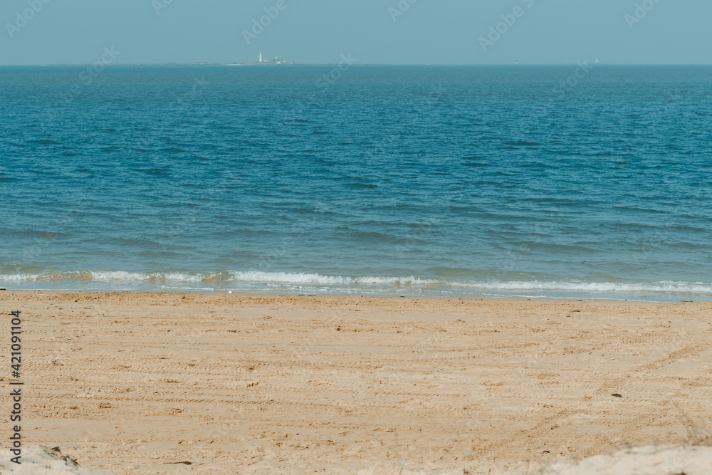 View of the beach at Beyt Dwarka in Gujarat, India. Sea waves crashing on the shore of the beach. Holiday relaxation concept. Sea waves at the shore, Relaxation at the beach. Summer travel background. View of the beach at Beyt Dwarka in Gujarat, India. Sea waves crashing on the shore of the beach. Holiday relaxation concept. Sea waves at the shore, Relaxation at the beach. Summer travel background.