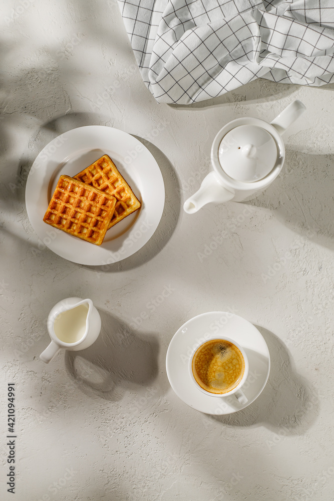 coffee with waffles on a white background