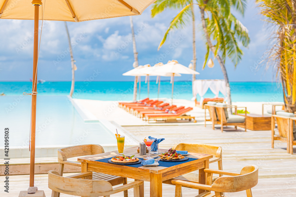 Picture of Luxury resort hotel poolside, outdoor restaurant on the beach, ocean ...
