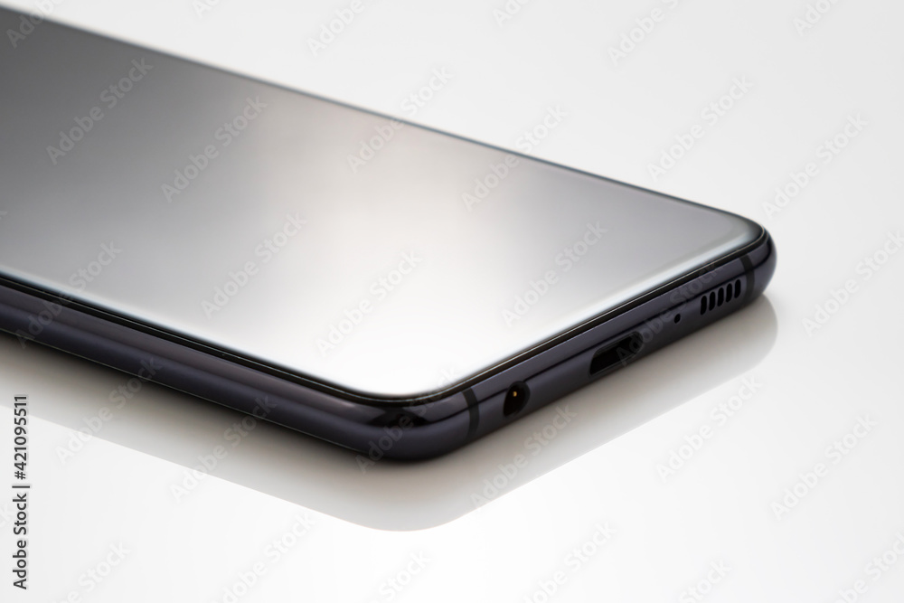 Mobile cell phone on white acrylic table for presentation product photography. Mobile cell phone on white acrylic table for presentation product photography.