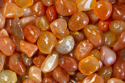 Cornelian geode stone as nice background. Beautiful natural crystal gemstone close up partial focused