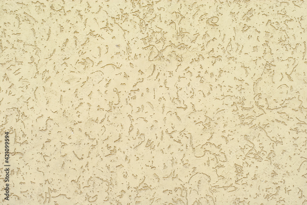 Plaster on a yellow wall. Concrete wall texture close up. Plaster on a yellow wall. Concrete wall texture close up.