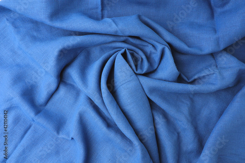 Abstract background, empty template. Blue fabric top view with wave curve flowinng for backdrop. Textile and texture concept.