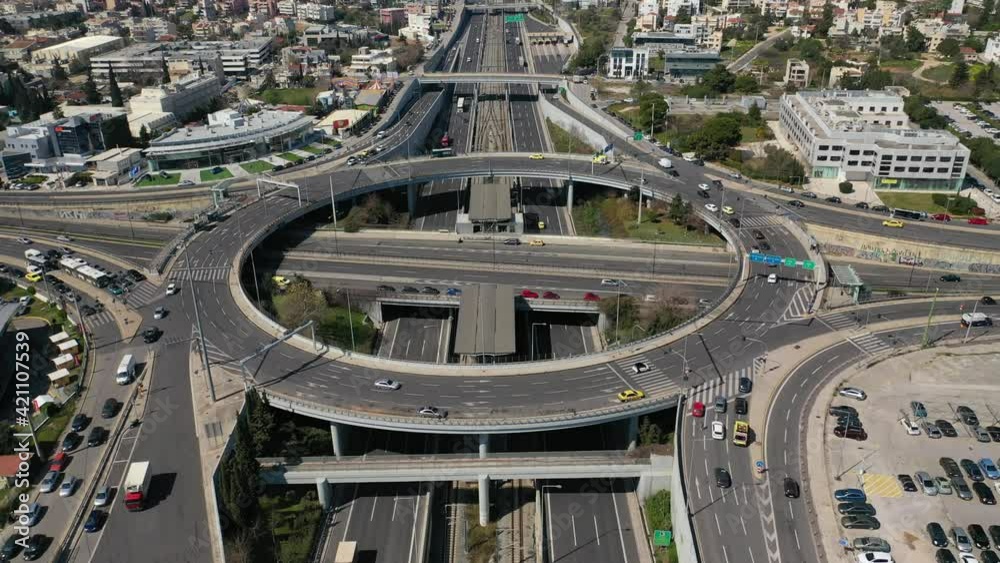 Aerial drone video of urban elevated toll ring road junction and interchange overpass connecting National road with city Aerial drone video of urban elevated toll ring road junction and interchange overpass connecting National road with city