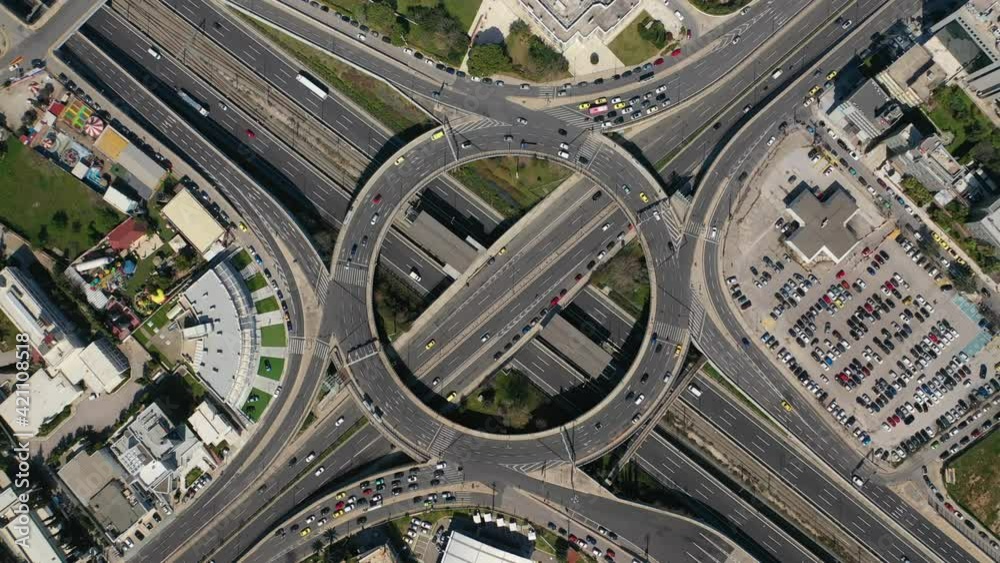 Aerial drone video of urban elevated toll ring road junction and interchange overpass connecting National road with city Aerial drone video of urban elevated toll ring road junction and interchange overpass connecting National road with city