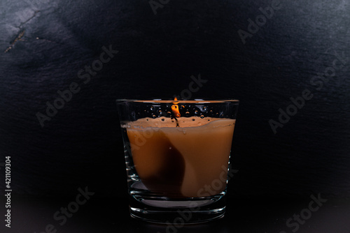 A candle in a glass