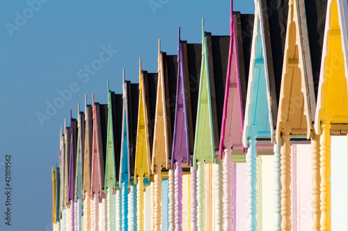Parade of colourful beach huts on Mersea Island in Essex