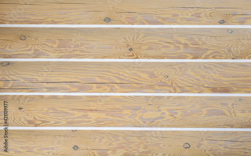 grout of joints on a log cabin. wooden logs background with natural wood texture