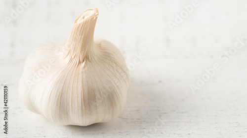 Garlic Bulb on a White Wooden Table