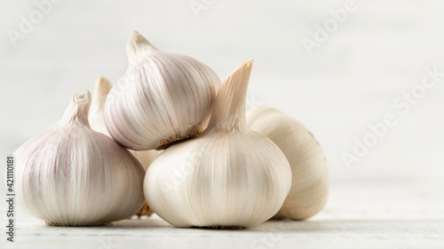 Several Garlic Bulbs on a White Background