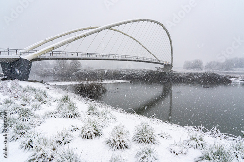 During a snowstrom, the Peter Courtney Minto Island Bridge, it connects Salem's Riverfront park to Minto Brown Park, Salem, Oregon photo