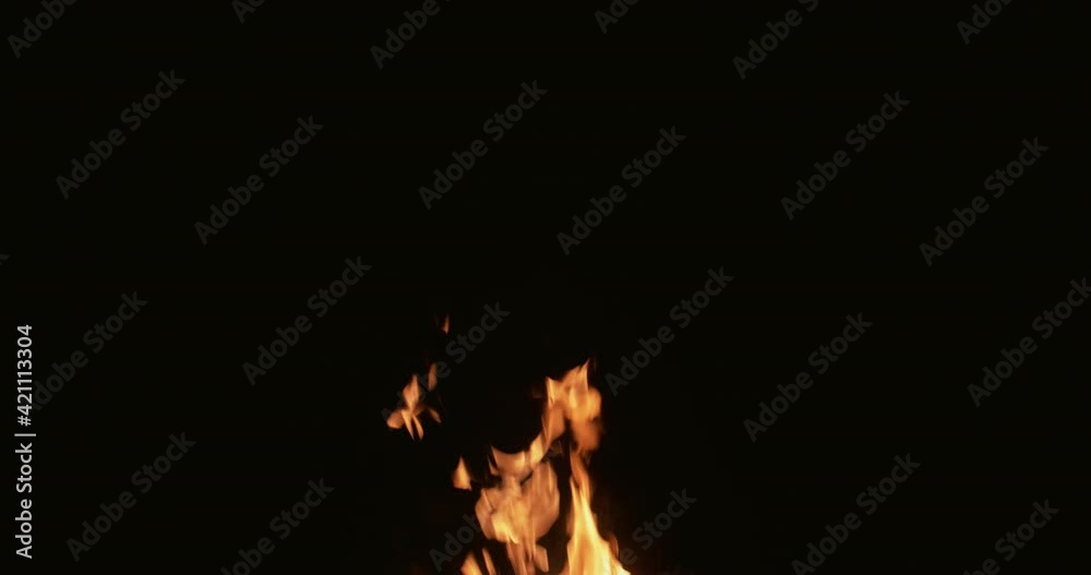 Flame background. Fire sparks on black. Night bonfire heat. Bright hot glowing orange blaze flakes flying up at night isolated on dark. Flame background. Fire sparks on black. Night bonfire heat. Bright hot glowing orange blaze flakes flying up at night isolated on dark.