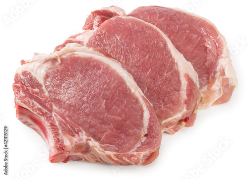 sliced raw pork meat isolated on white background. Clipping path and full depth of field photo