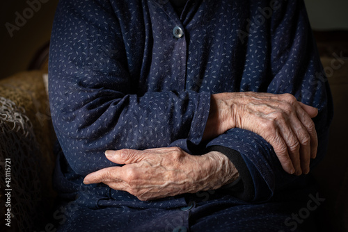 Elder grandmother woman crossing her wrinkled beautiful hands. Aging human process