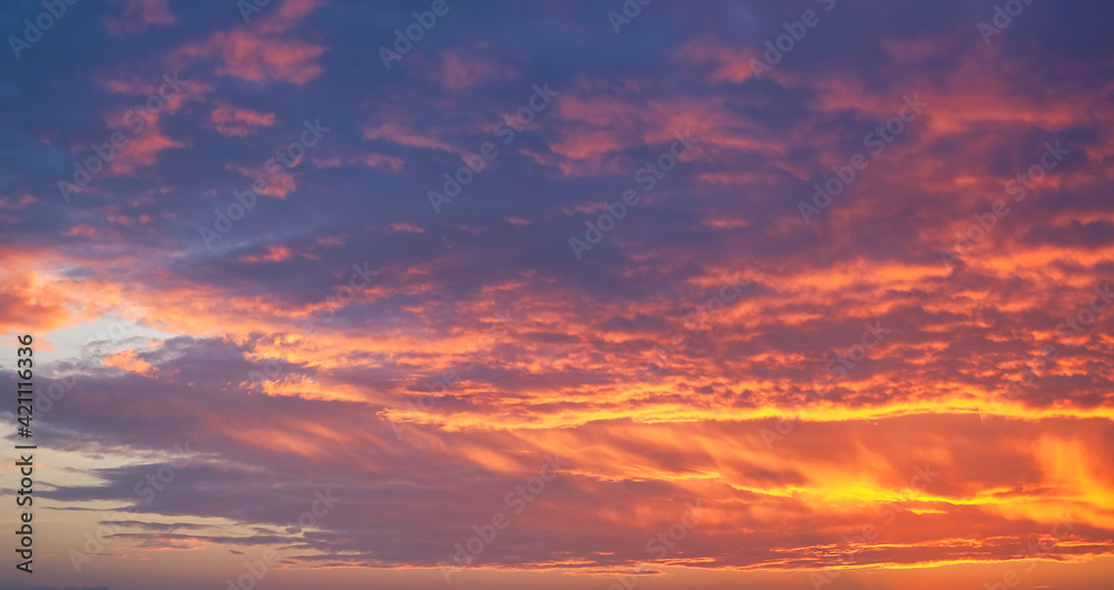 Beautiful dramatic neon sunrise with clouds