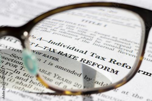 Closeup of the documents of the Tax Cuts and Jobs Act  TCJA  of 2017. Selective focus on the phrase  Tax Rate Reform. 