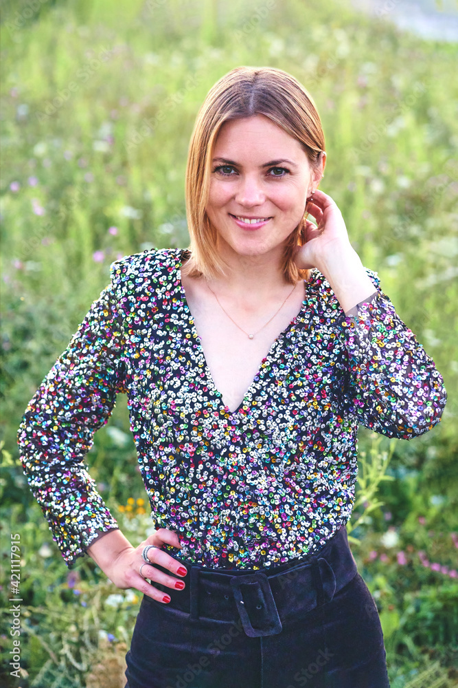 Portrait of a young beautiful smiling blonde woman outdoors Portrait of a young beautiful smiling blonde woman outdoors