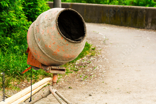 Wallpaper Mural The concrete mixer, boards for construction. cement mixer at a construction site. Torontodigital.ca