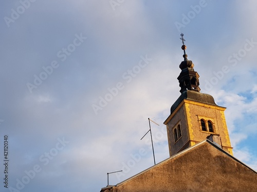 Churche tower iluminate with sun photo