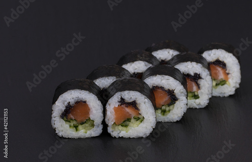 Sushi Rolls Sake Kappa Maki with RICE, SALMON, CUCUMBER and MASAGO