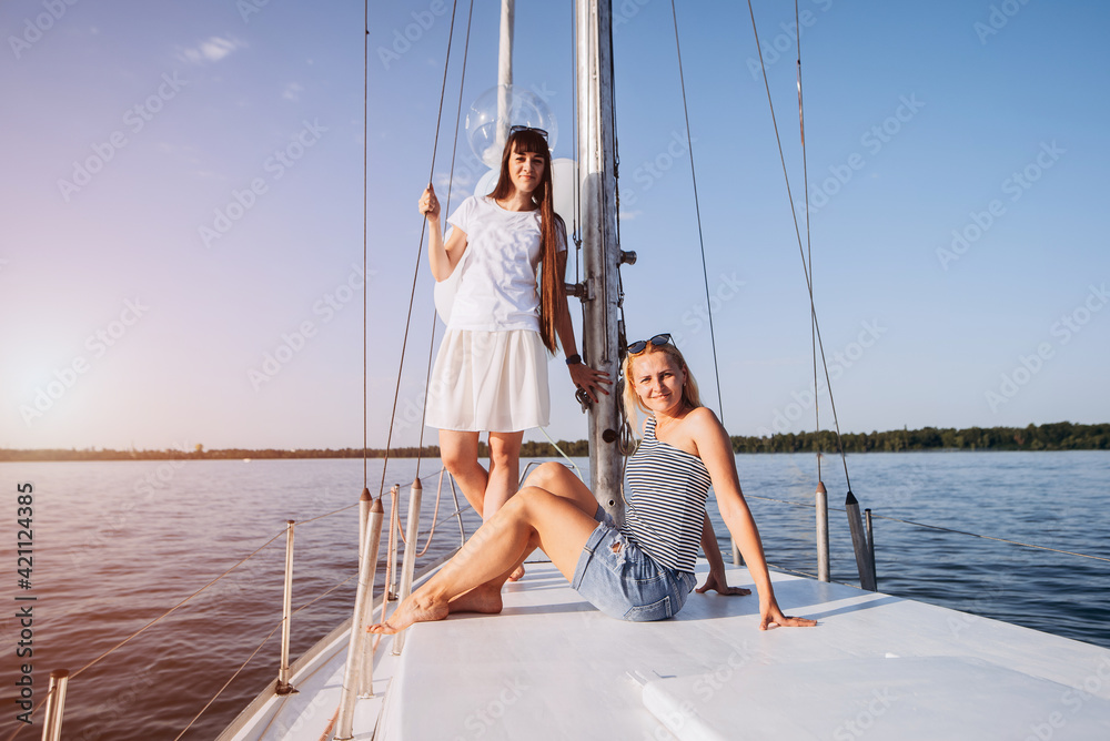 Girls having fun at yacht on hen party. Boat trip Girls having fun at yacht on hen party. Boat trip