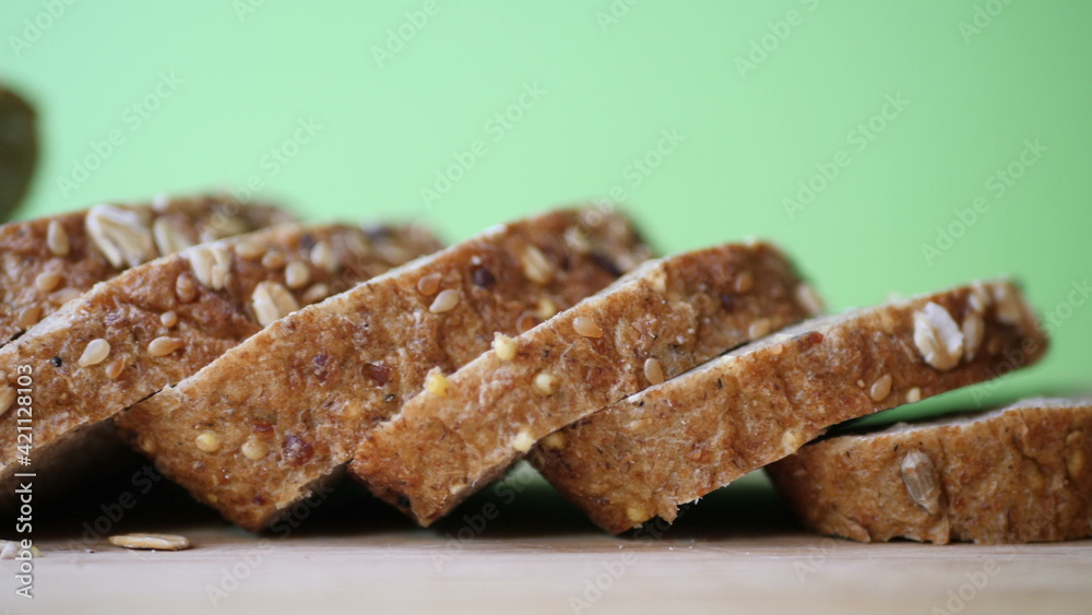 Slicing Whole Grain Bread On Wooden Table. Slicing Whole Grain Bread On Wooden Table.