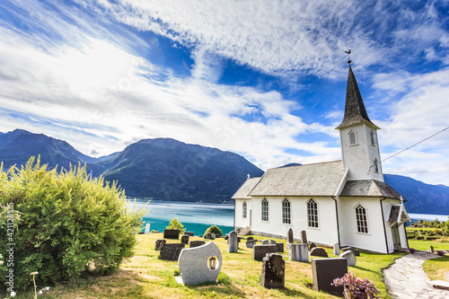 Obraz na plátně Churchyard in Nes village at fjord, Norway