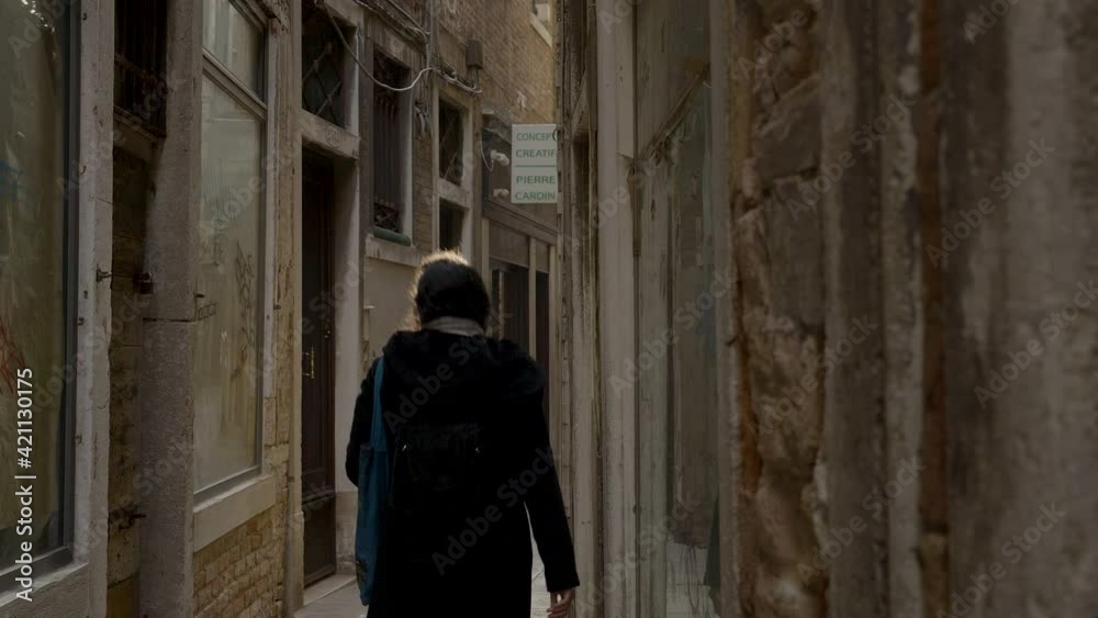 Narrow alley in Venice, Italy, with empty store windows Narrow alley in Venice, Italy, with empty store windows