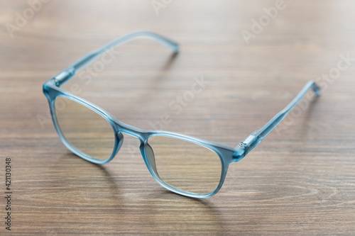 Eyeglassed blue color on wooden table office