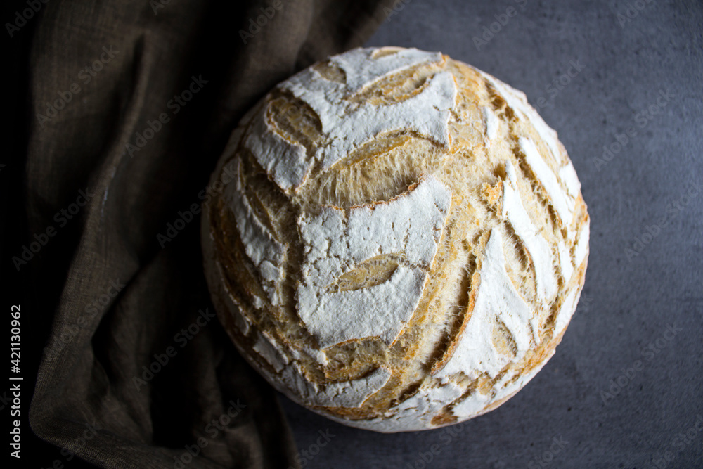 Sourdough bread texture close up. Crusty bread with beautiful pattern on the top. Healthy eating concept. Sourdough bread texture close up. Crusty bread with beautiful pattern on the top. Healthy eating concept.