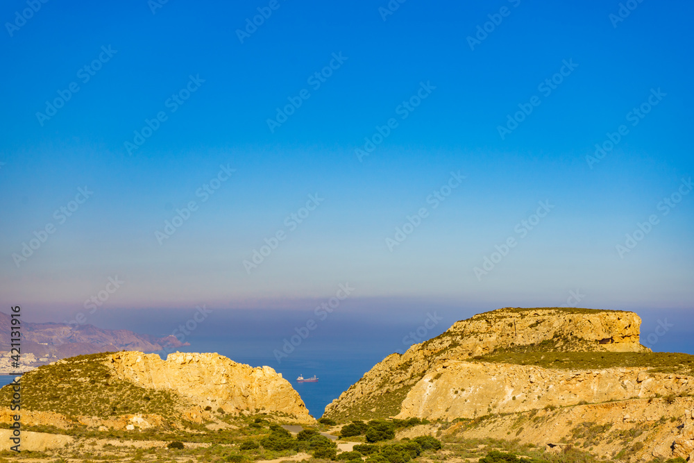 Rocky coast Landscape with ship on sea, Spain Rocky coast Landscape with ship on sea, Spain
