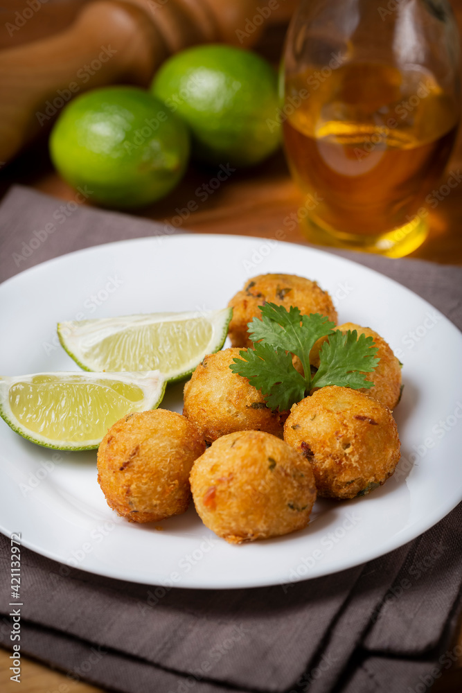 Cod dumpling. Traditional brasilian snack. Bunuelos de bacalão.