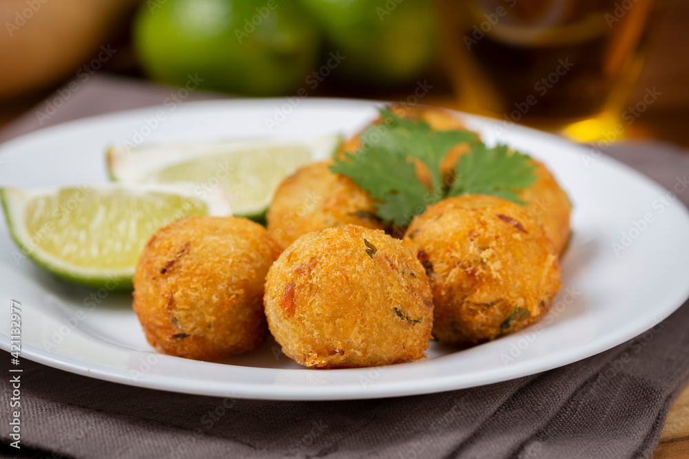 Cod dumpling. Traditional brasilian snack. Bunuelos de bacalão.