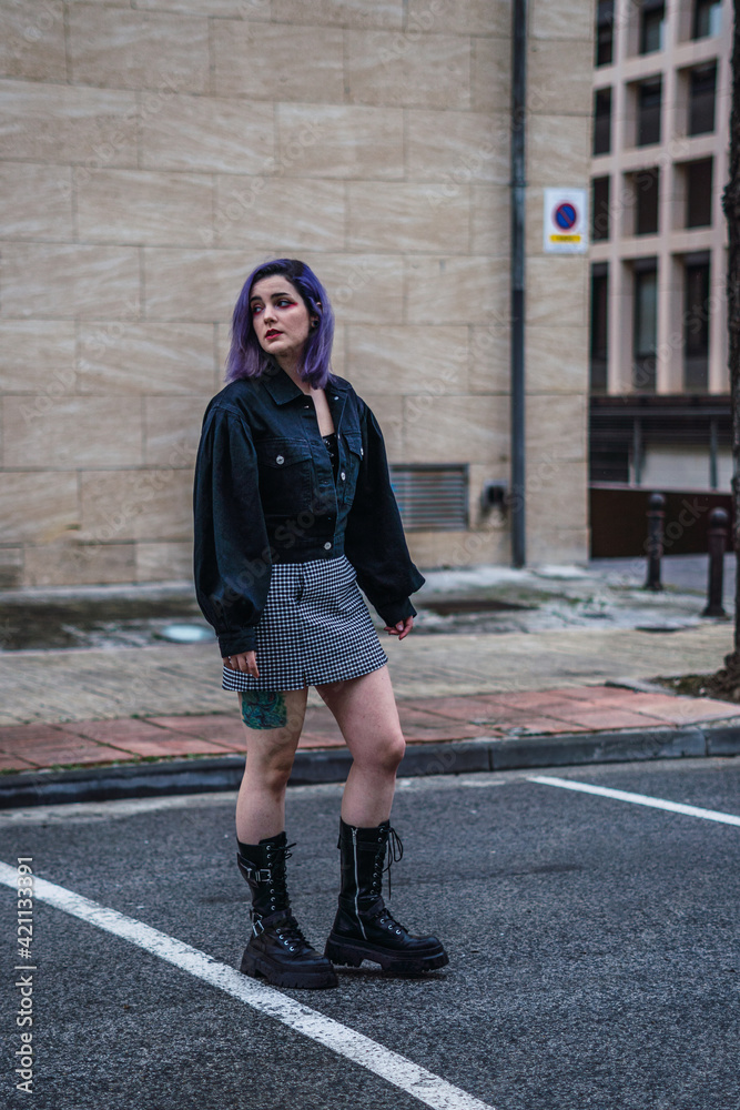 Young woman with purple hair walking on the street Young woman with purple hair walking on the street