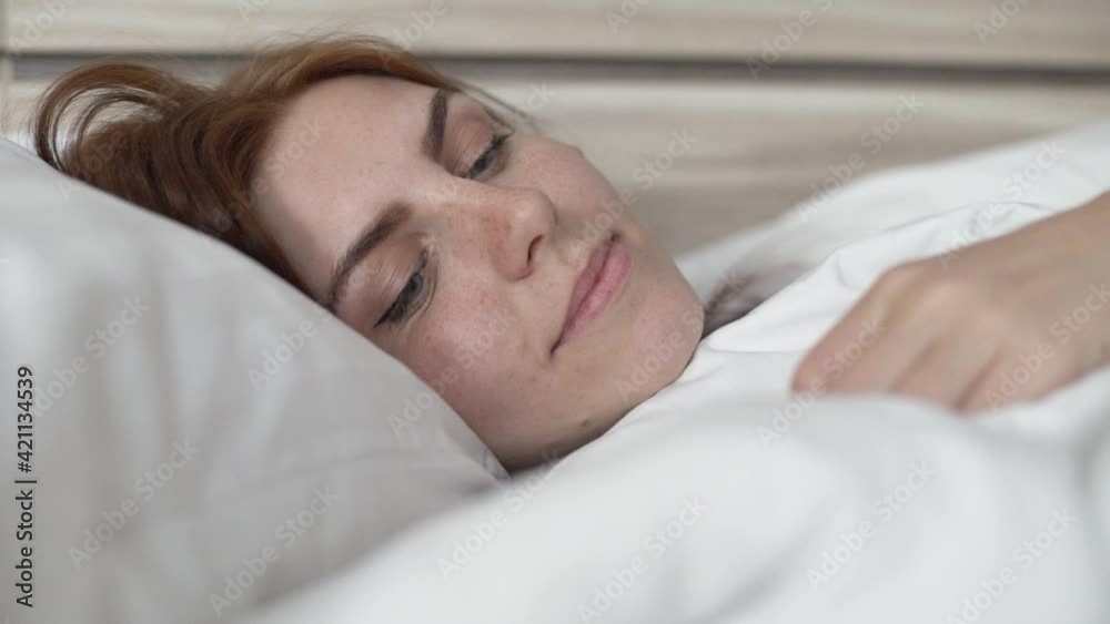 beautiful girl is sad in bed at home herself on self-isolation during quarantine beautiful girl is sad in bed at home herself on self-isolation during quarantine