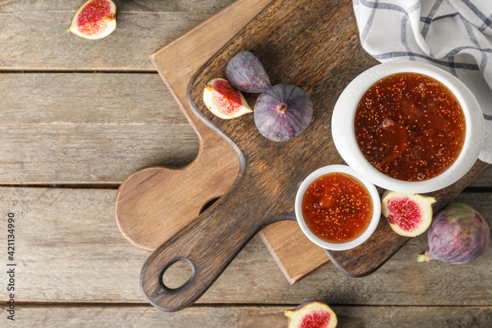 Bowls of sweet fig jam on wooden table Bowls of sweet fig jam on wooden table