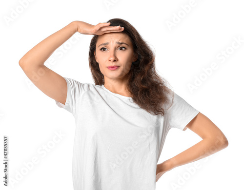 Stressed young woman on whi...