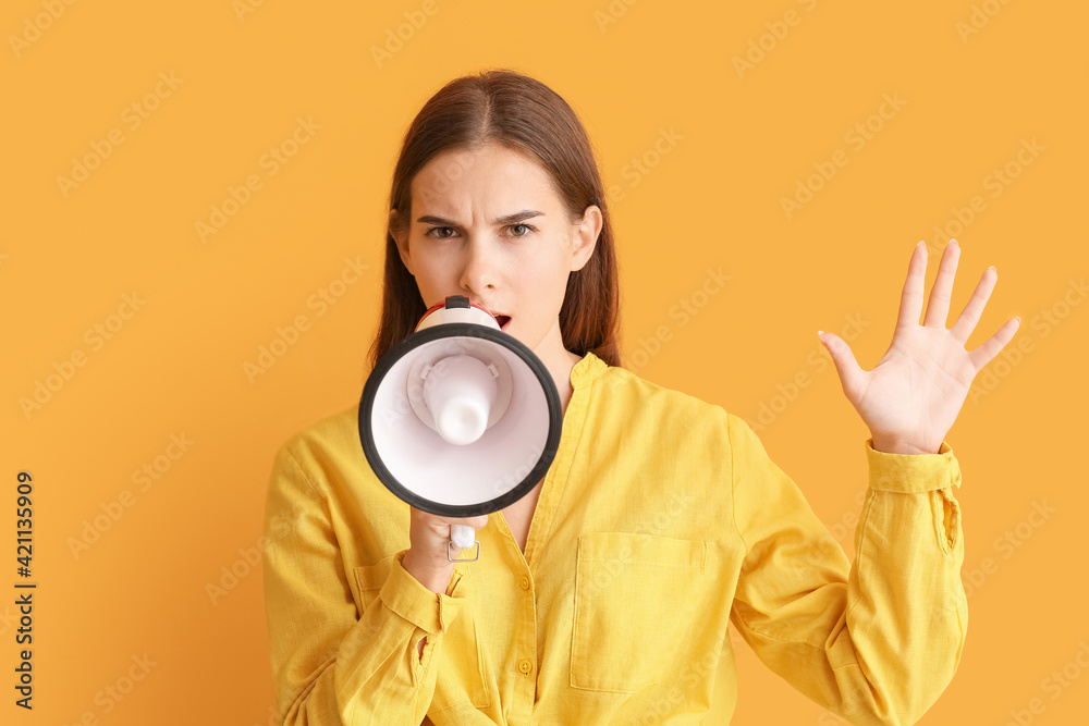 Young woman with megaphone on color background Young woman with megaphone on color background