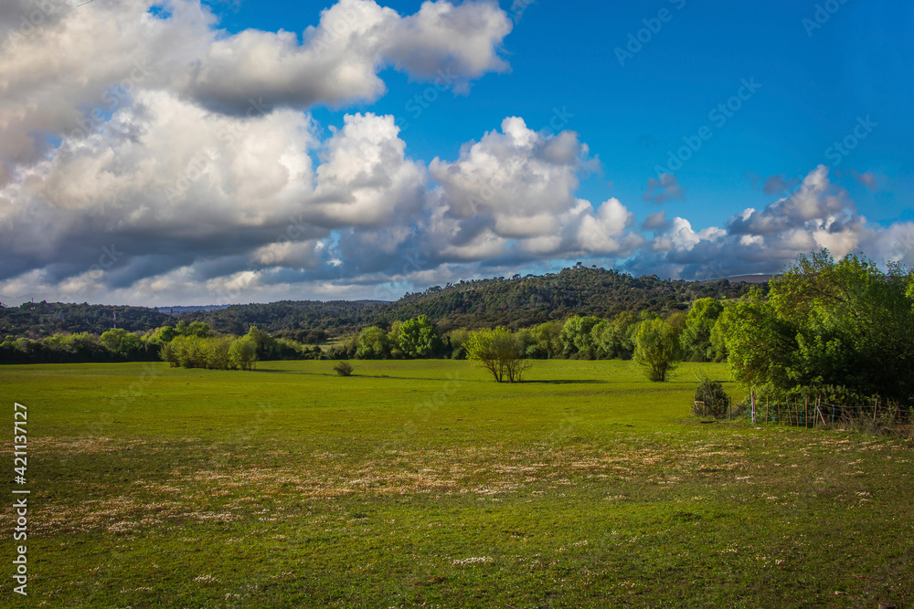 Landscape with sky and clouds and mountains background. View of Serra de Aire, Portugal from the park of Olhos de Água