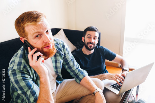 Male couple working at home