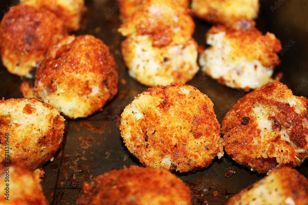 Closeup of potato croquettes on a baking sheet Closeup of potato croquettes on a baking sheet