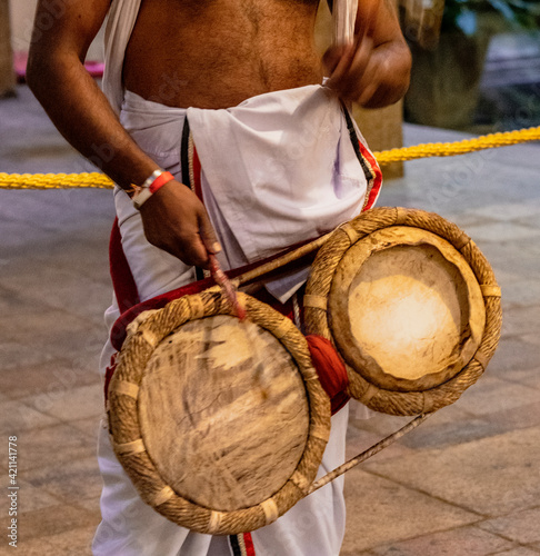 Priest Beats Drums at the Temple of the Tooth Relic in Kandy Sri Lanka. photo