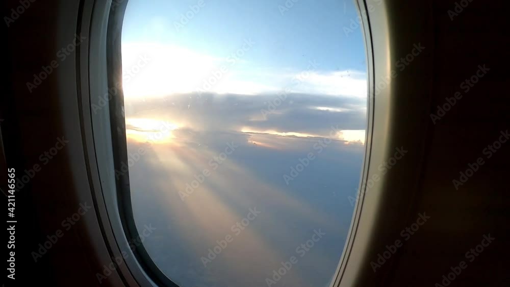 A beam of light from the sun can be seen through the plane's window.
A beam of light from the sun can be seen through the plane's window.